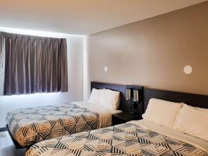 Postel nebo postele na pokoji v ubytování Motel 6 Sinton TX + 26 fotografií