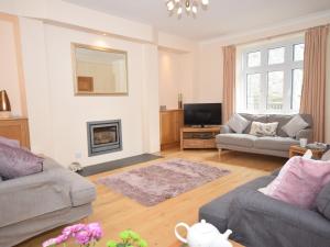 a living room with two couches and a fireplace at 5 bed in Barnstaple SHIRW in Shirwell