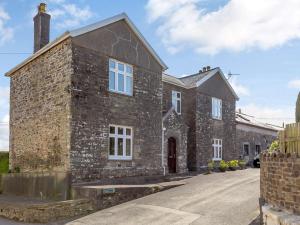an old brick house with white windows on a street at 5 bed in Barnstaple SHIRW in Shirwell