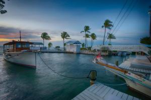 a boat is docked at a dock in the water at Casa Morada in Islamorada