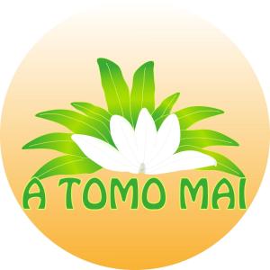 a logo for a mommama with a white flower at A TOMO MAI in Uturoa