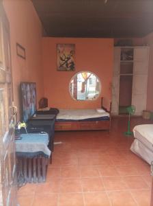 a room with two beds and a window at Hospedaje Marlenis in Managua