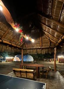 a pavilion with a picnic table at Glamping El Encanto in Zapopan