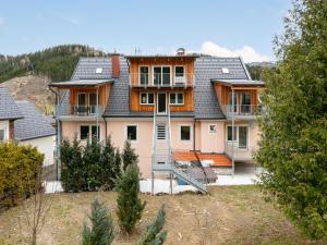 a house with a staircase in front of it at NRV Top 567 XL in Möderbrugg