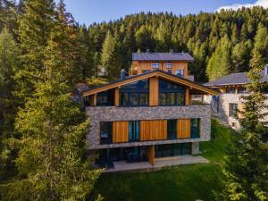 an aerial view of a house in the woods at Vista Lodge in Turracher Hohe