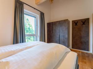 Łóżko lub łóżka w pokoju w obiekcie Wanderlust Mountain Chalet