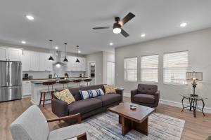 a living room with a couch and a table at Spacious family retreat 2 of 2 - jz vacation rentals in Tower Grove