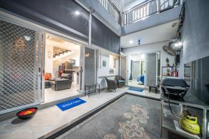 an open living room with a grill in the middle at Modern villa with private pool , full kitchen and parking in Legian