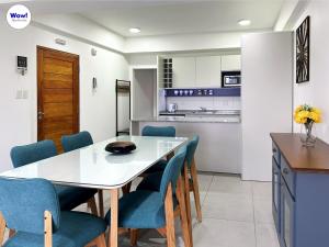 a kitchen and dining room with a table and chairs at Wow! Ushuaia Apartments in Ushuaia