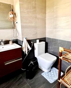 a bathroom with a toilet and a sink at Rest, sea and sun in Agadir