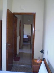Postel nebo postele na pokoji v ubytování Hotel Apolafsi