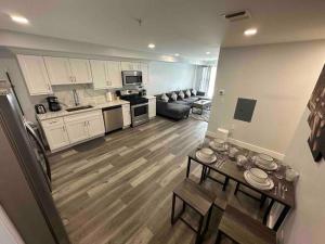 a kitchen and living room with a couch and a table at The Classic Suite: 2BR close to NYC in Paterson