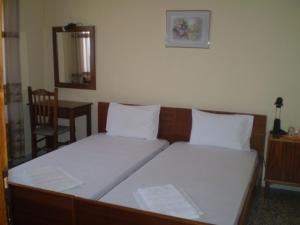 Postel nebo postele na pokoji v ubytování Hotel Apolafsi