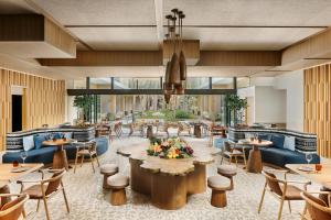 a rendering of a restaurant with tables and chairs at Six Senses Kyoto in Kyoto