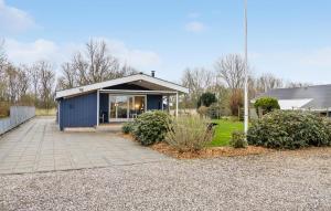 cobertizo azul con patio en 3 Bedroom Amazing Home In Otterup, en Otterup 10 fotos más