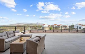 a patio with a couch and chairs and a table at Holiday Home Tina in Oklaj +35 photos