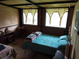 Katil atau katil-katil dalam bilik di Posada Turistica Los Joseph