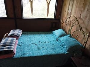 Katil atau katil-katil dalam bilik di Posada Turistica Los Joseph