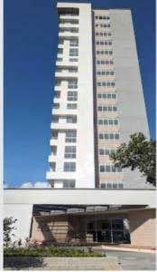 a tall white building with a lot of windows at HABITACION NOVA CONDOMINIO PLUS CALI in Cali +4 photos