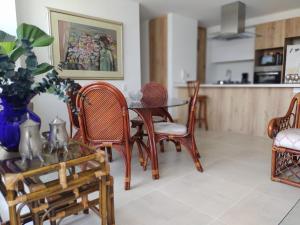 a dining room with a table and chairs at HABITACION NOVA CONDOMINIO PLUS CALI in Cali