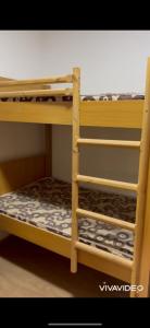a set of bunk beds in a room at مزرعة كراون in Umm el ‘Amad
