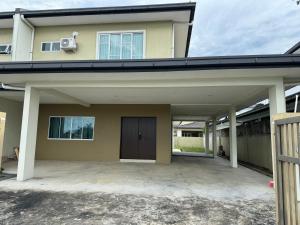 a detached house with a garage and a driveway at MR homestay depo link in Kuching