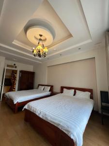 Letto o letti in una camera di Dang Uyen 1 Hotel