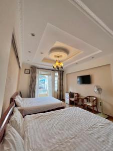 Letto o letti in una camera di Dang Uyen 1 Hotel