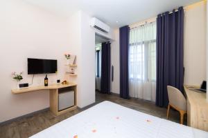 Μια τηλεόραση ή/και κέντρο ψυχαγωγίας στο Khách sạn Phước Lộc Thọ 2 - 福禄寿