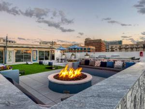 a fire pit on the roof of a building at Elite Retreat in Addison Circle in Addison
