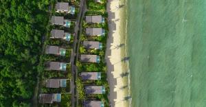 an overhead view of a group of houses next to the beach at Six Senses Con Dao - Turtle Island Paradise in Con Dao