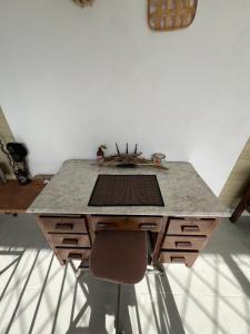 a table in a room with a counter top at Adella's Blue Mountain Coffee Farmstay in Kingston