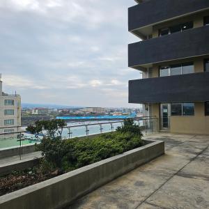 a building with a view of a body of water at Beautiful Sunset Jejubi House2 in Jeju