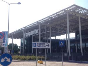 a large building with a sign in front of it at Antonella's House in Bresso