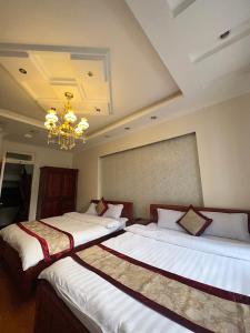 Letto o letti in una camera di Dang Uyen 1 Hotel