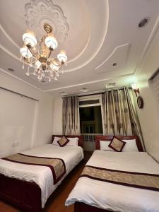 Letto o letti in una camera di Dang Uyen 1 Hotel