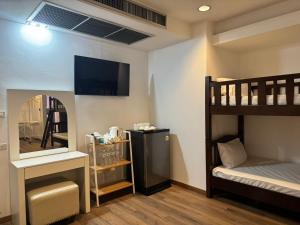 Postel nebo postele na pokoji v ubytování Neo Hatyai Hotel