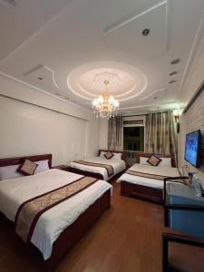 Letto o letti in una camera di Dang Uyen 1 Hotel