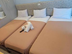Postel nebo postele na pokoji v ubytování D' Loft Iligan