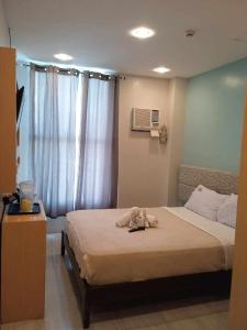Postel nebo postele na pokoji v ubytování D' Loft Iligan