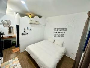 Postelja oz. postelje v sobi nastanitve Nanwan254 Homestay