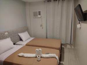 Postel nebo postele na pokoji v ubytování D' Loft Iligan