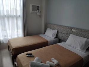 Postel nebo postele na pokoji v ubytování D' Loft Iligan