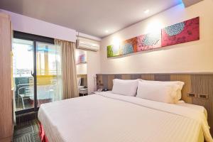 Postel nebo postele na pokoji v ubytování Macchi Hotel - Taipei