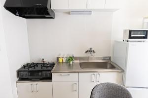 Cucina o angolo cottura di Lino下伊福 岡山駅車で5分 無料駐車場 レストラン徒歩圏内多数