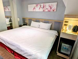Postel nebo postele na pokoji v ubytování Macchi Hotel - Taipei