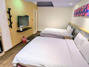 Postel nebo postele na pokoji v ubytování Macchi Hotel - Taipei