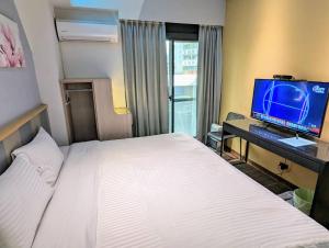 TV a/nebo společenská místnost v ubytování Macchi Hotel - Taipei + 33 fotografií