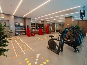 a gym with cardio equipment in a hotel room at Radisson Hotel, Beijing DaXing Airport in Beijing
