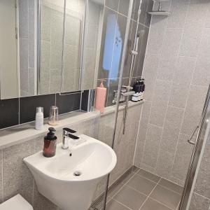 a bathroom with a sink and a shower at Hygge 722 Blue Ocean4 in Incheon